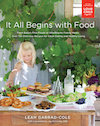 Cover of It All Begins with Food, showing a blond child reaching into a table full of food outdoors.