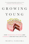 Growing Young cover, showing a drawing of a birthday cake with many candles.