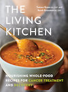 Cover of The Living Kitchen, showing a close-up view of a person holding a bowl of reddish-brown soup.