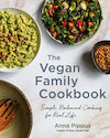 Cover of Vegan Family Cookbook, showing a top view of three dishes of food on a marble countertop.